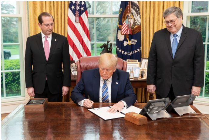 photo of President signing Executive Order regarding Defense Production Act